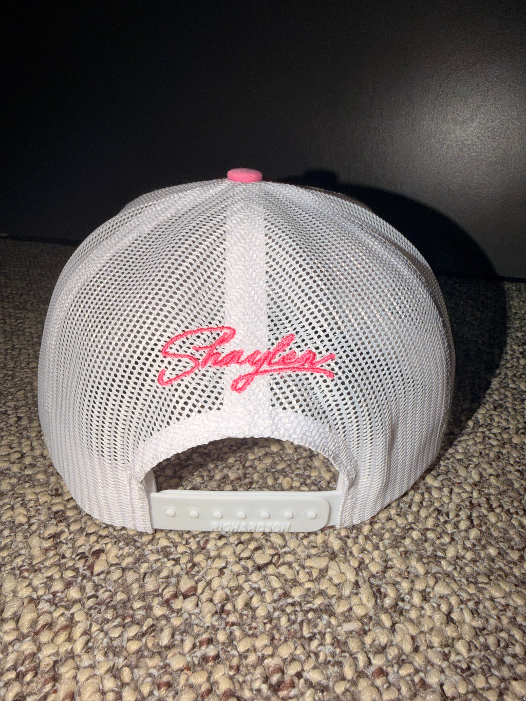 Pink and white trucker hat with ‘Got Daddy Issues?’ embroidered on front and Shaylen signature embroidered on back