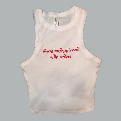 White Bella Canvas crop tank top with red embroidered text reading "Wearing something low-cut on the weekend" — Shaylen Lee Carroll official merch Nashville